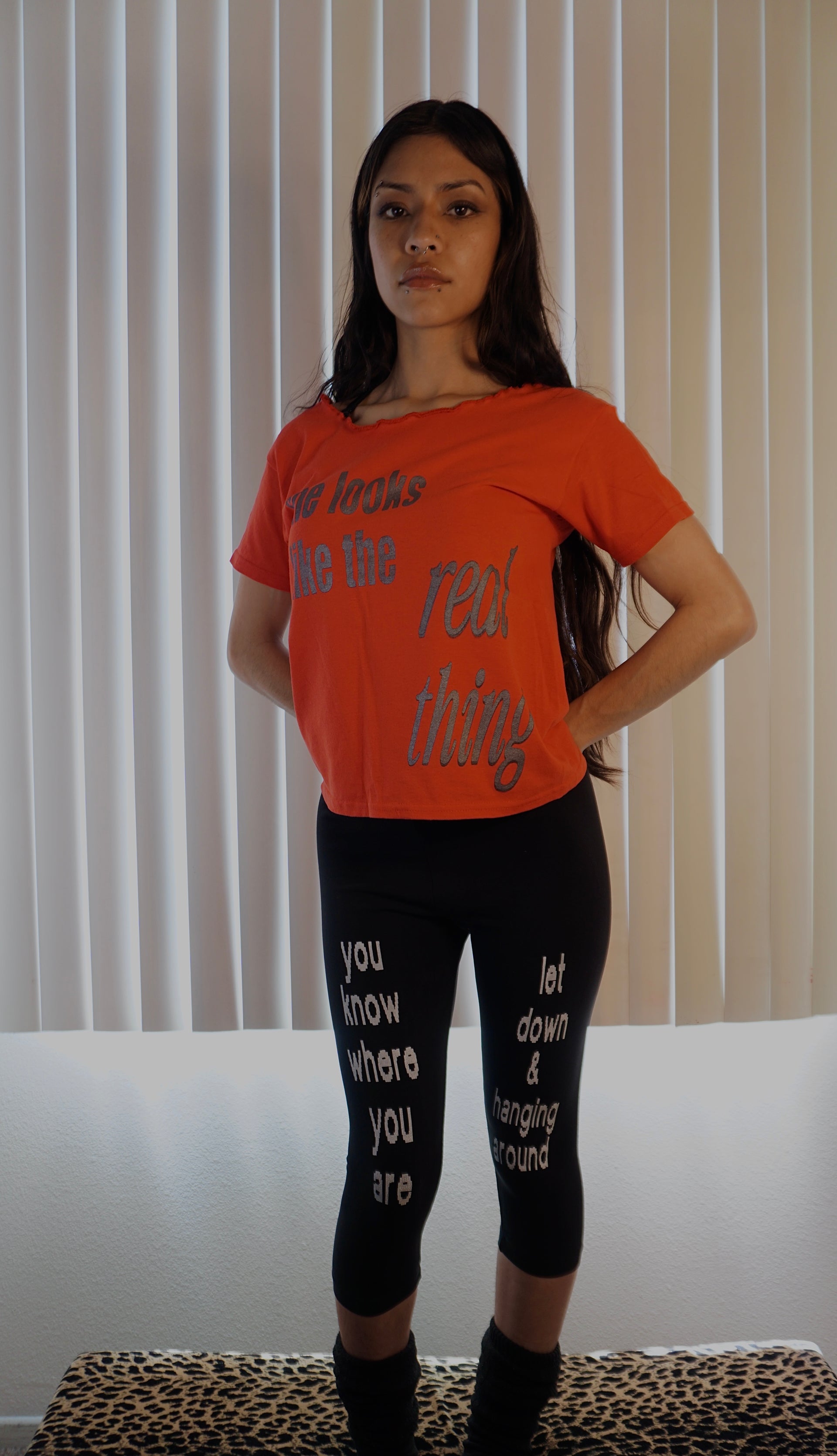 She looks like the real thing off the shoulder tee