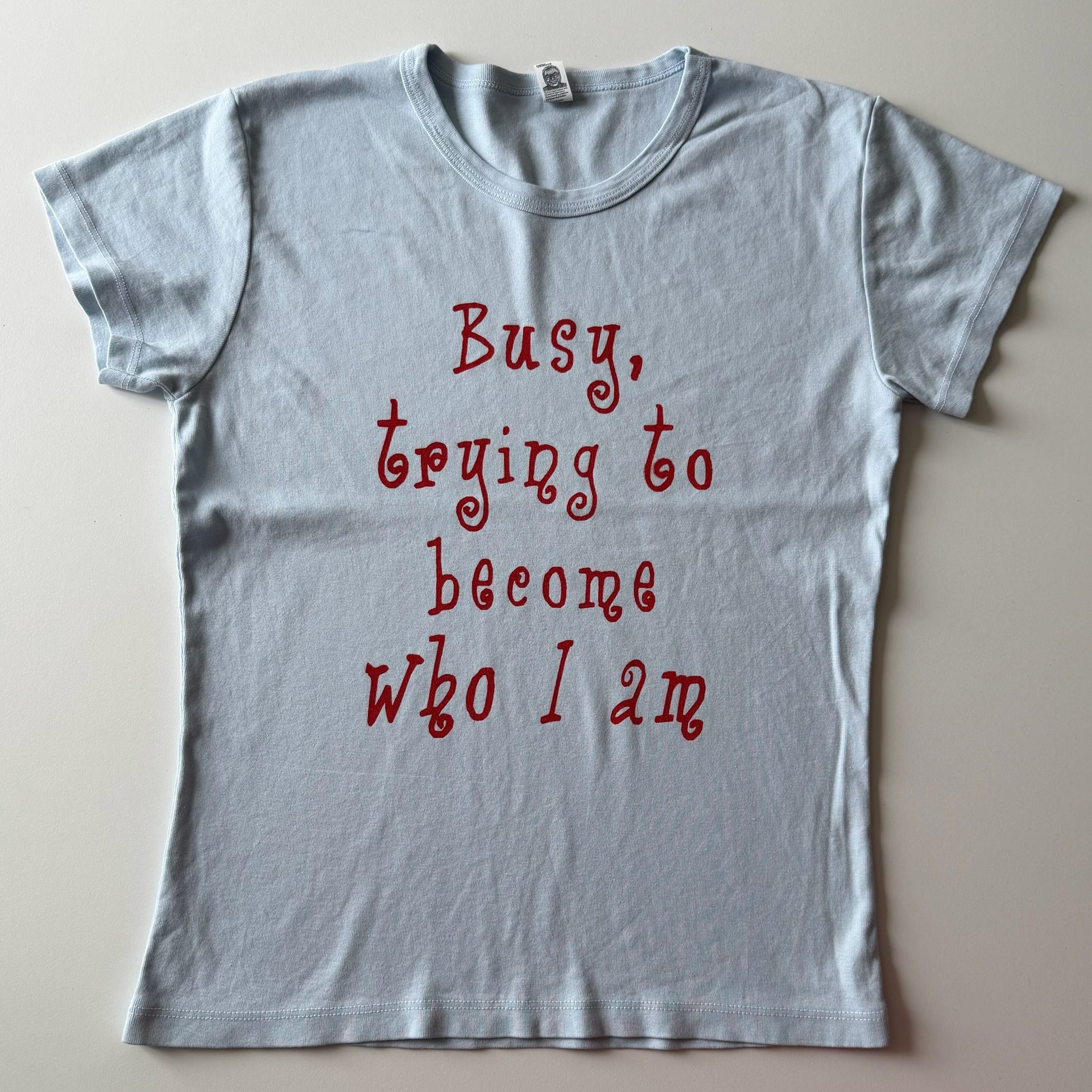 Busy trying to become who i am baby tee - XL