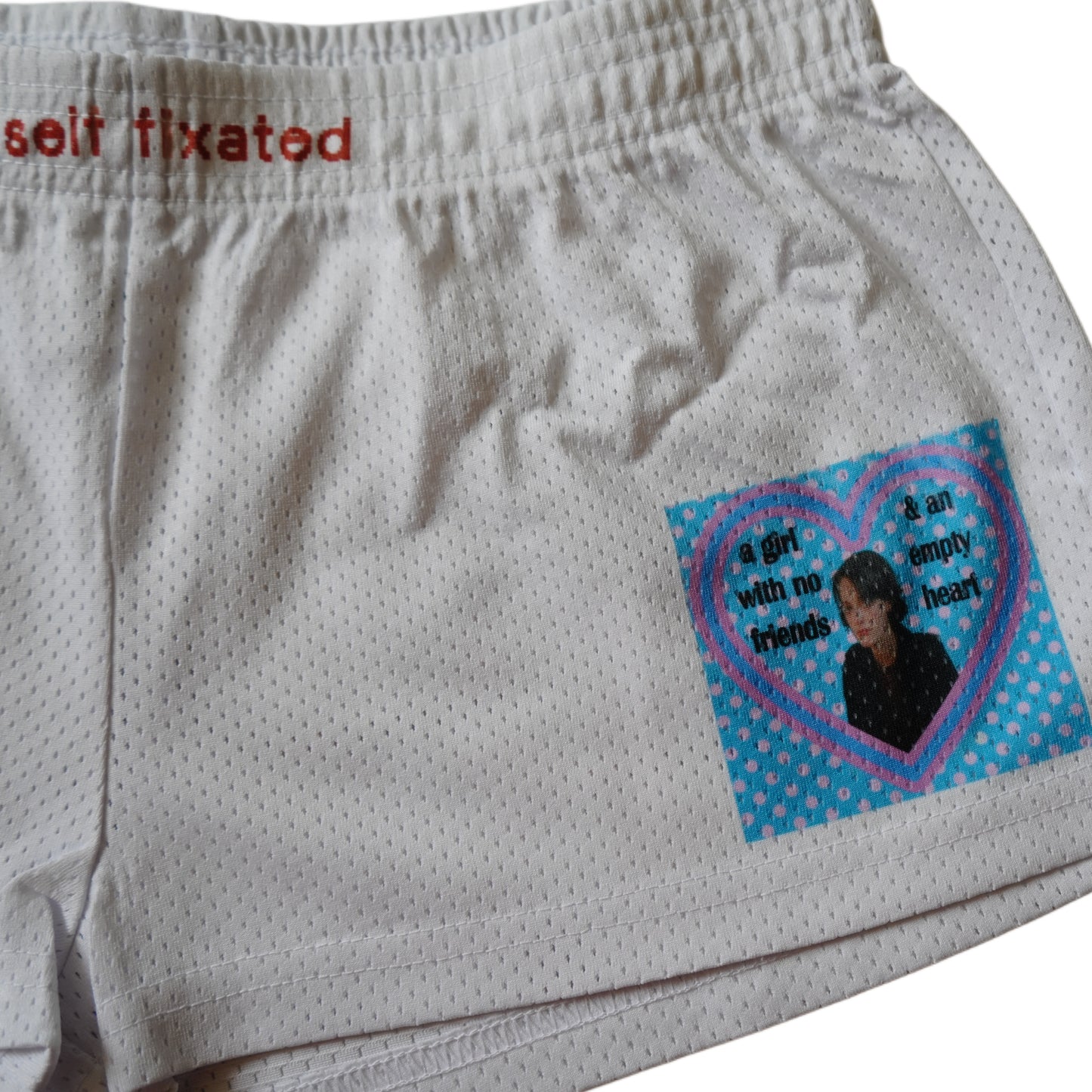 A girl with no friends & an empty heart mesh micro shorts