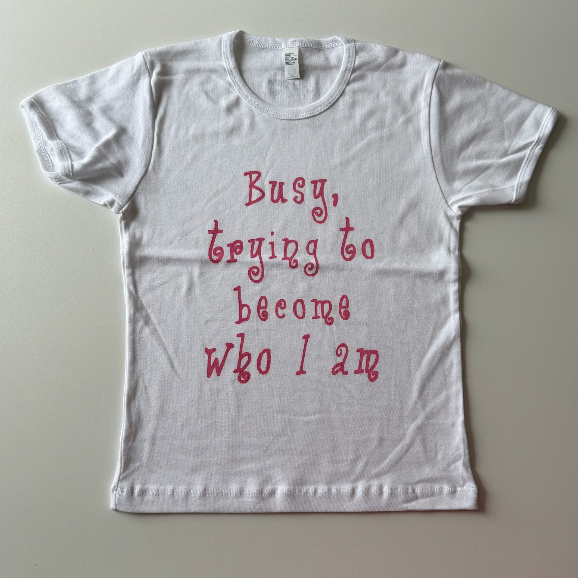 Busy trying to become who I am baby tee - L