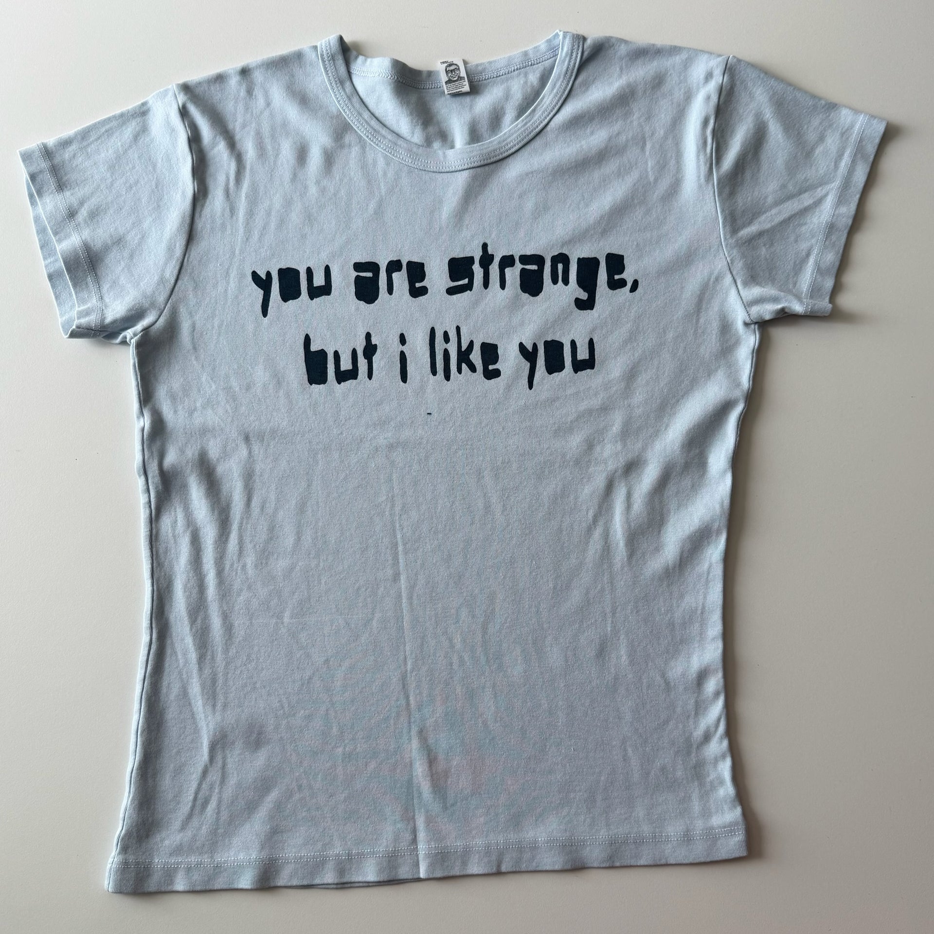 You are strange... baby tee - XL