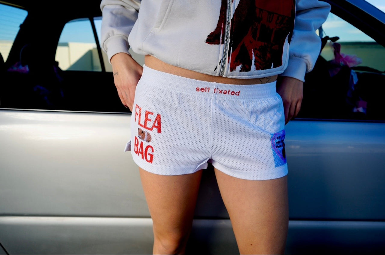 A girl with no friends & an empty heart mesh micro shorts