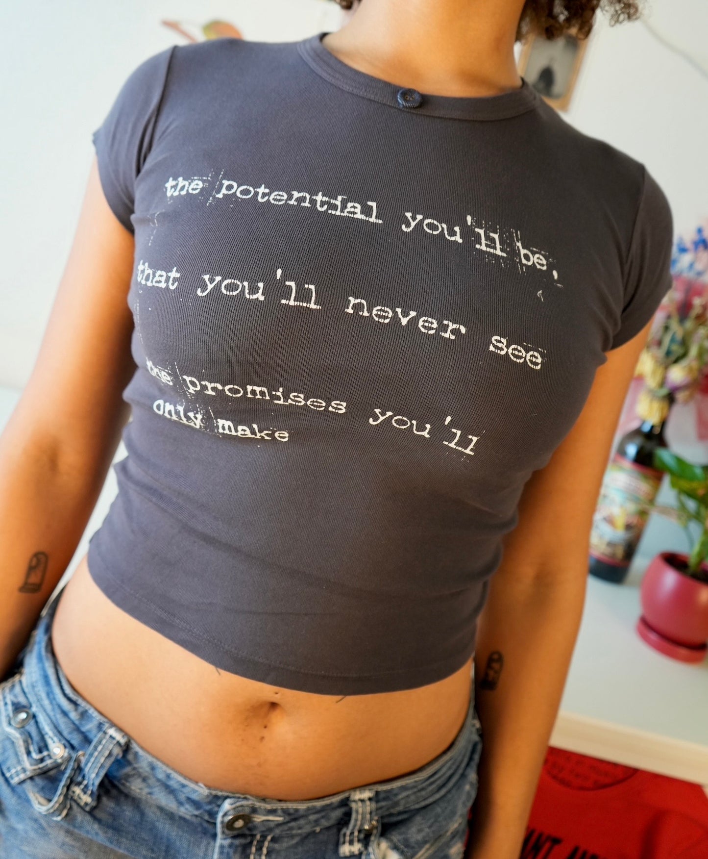 Between the bars baby tee