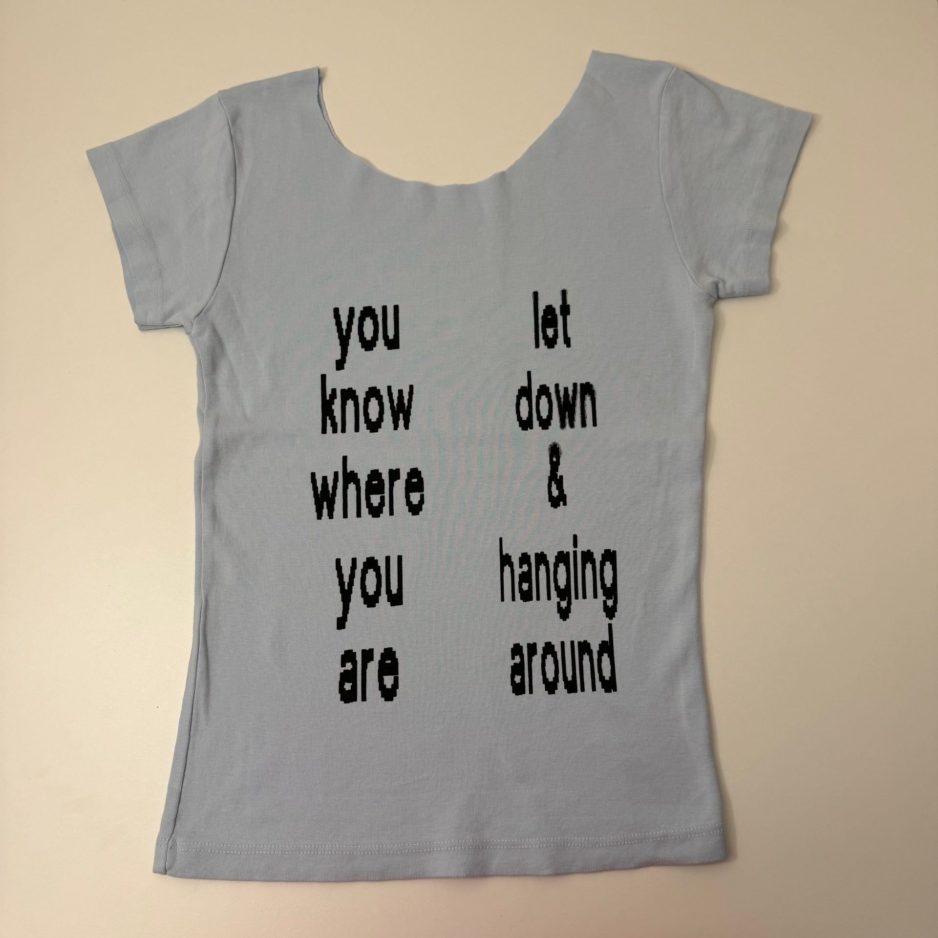 Let down off the shoulder baby tee - S